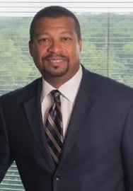 Headshot of Michael E. Johnson '87